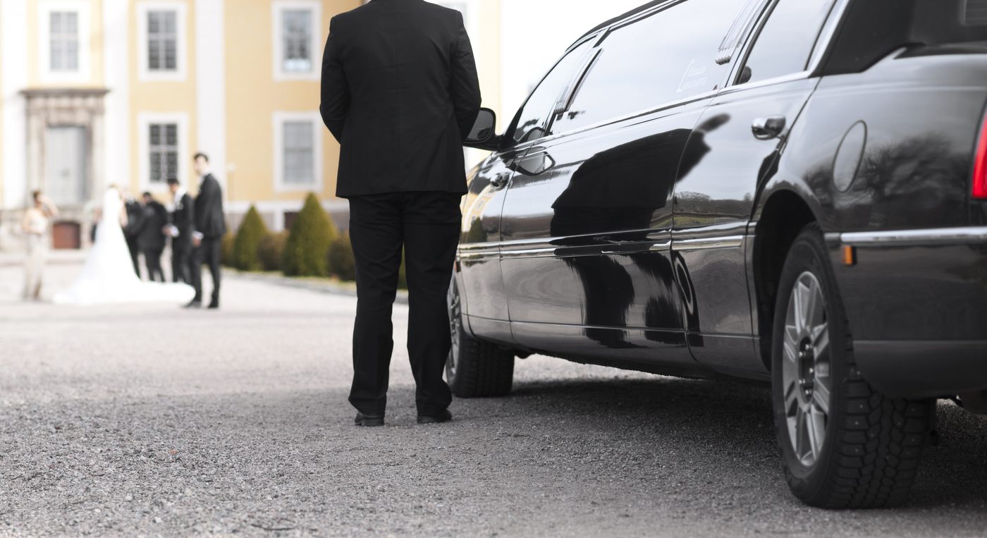 Chauffeur opening car door
